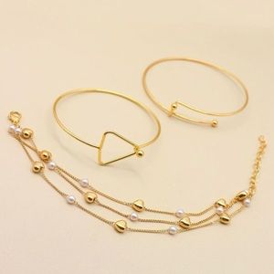 Gold 3 piece set bracelet.